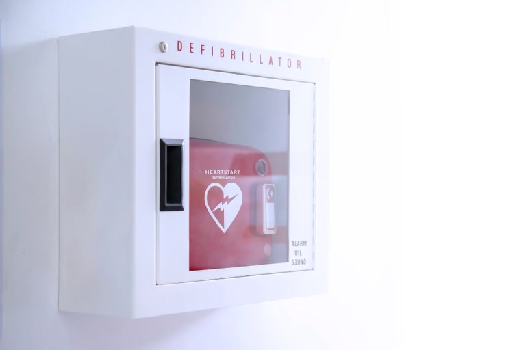 Automated,External,Defibrillator,(aed),In,White,Box,On,The,Wall
